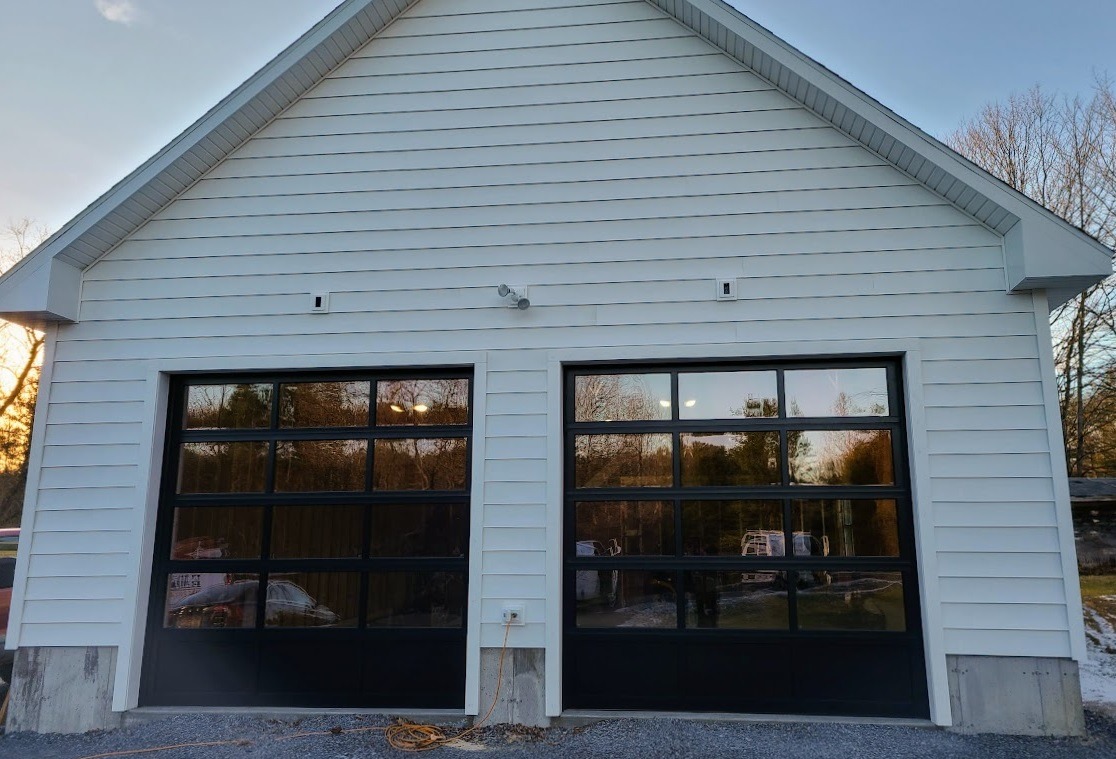 CHI Full View Glass Garage Doors with Solid Bottom Panel