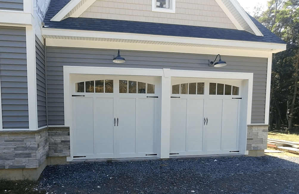 Carriage Overlay Garage Doors with Arched Windows and Recessed Panels